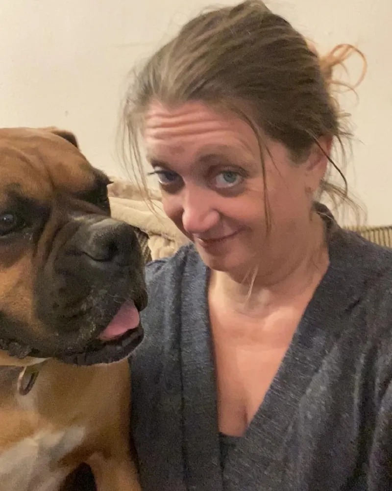 Stacey of Draco Boxers with Draco, a fawn Boxer with a black mask